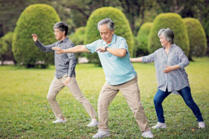 Older adults practicing tai chi for weight loss